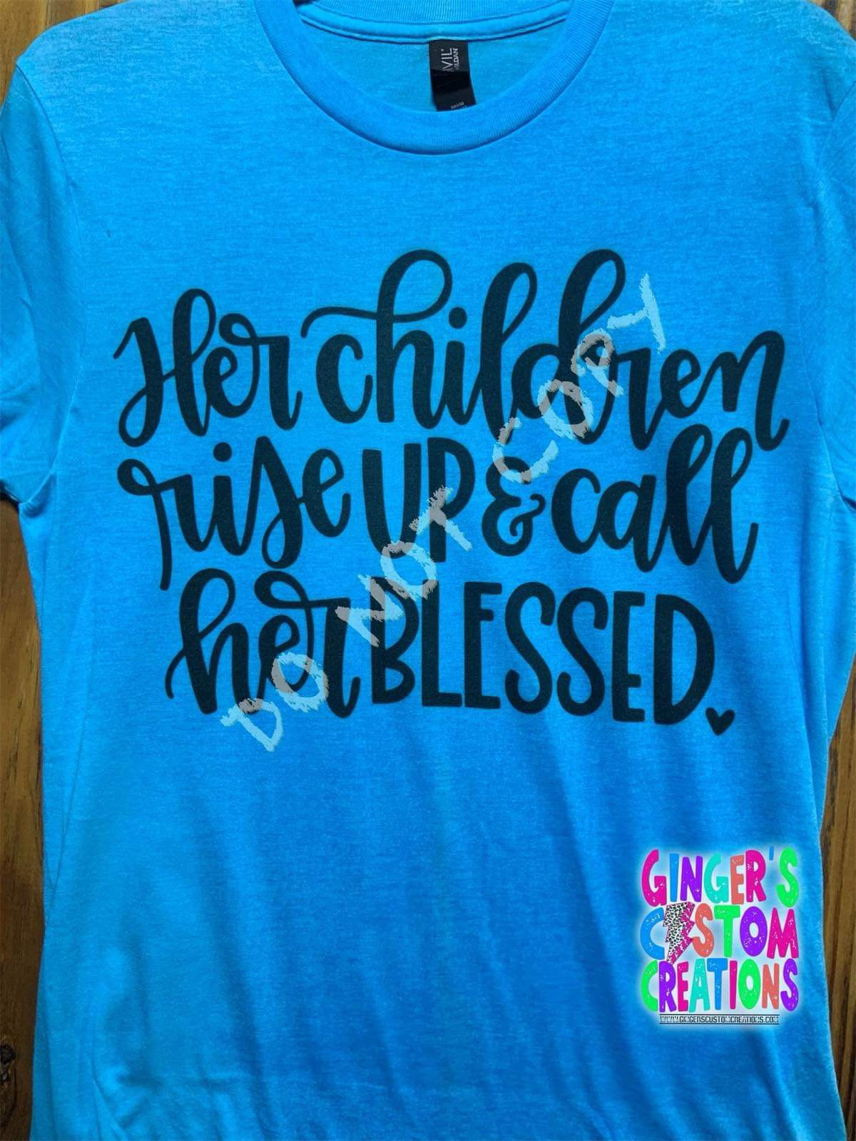 HER CHILDREN RISE UP AND CALL HER BLESSED BLEACHED SHIRT